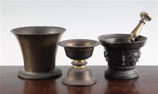 Two mortars, a pestle and brass stand